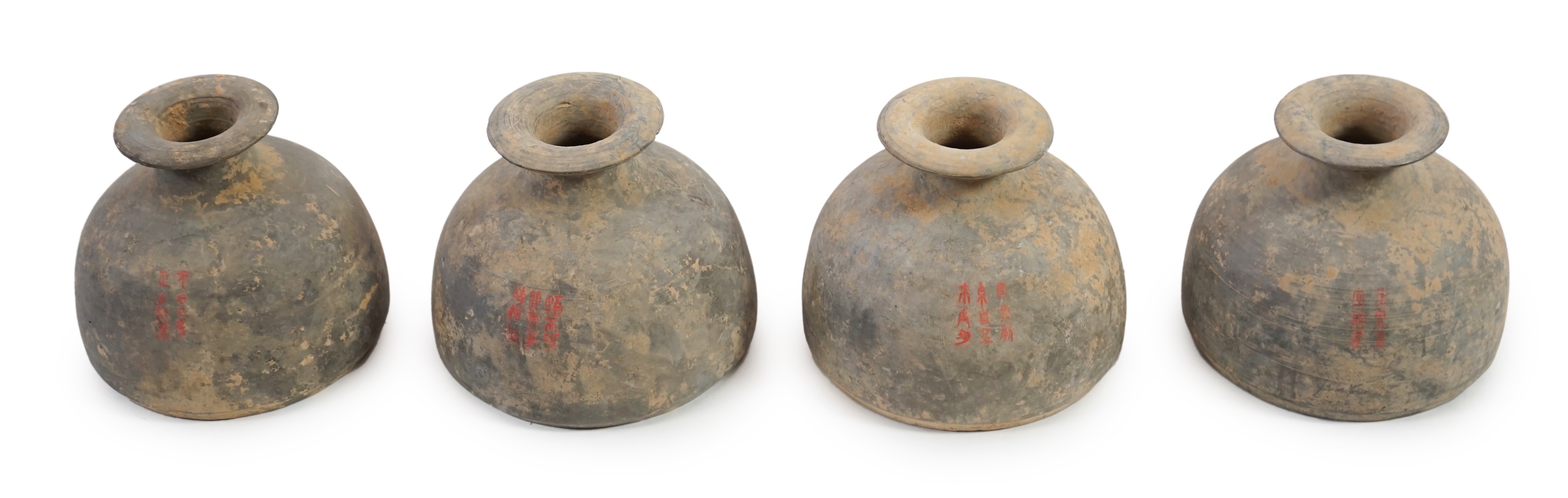 Four very rare Chinese inscribed pottery jars, Han dynasty